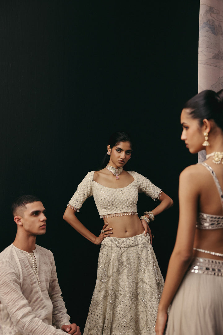 Silver Zari Mirrorwork Lehenga with Cape Sleeves Jacket and Bralette