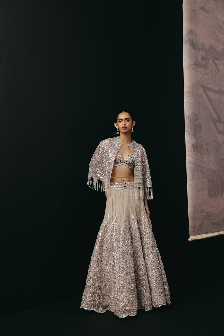 Silver Zari Mirrorwork Lehenga with Cape Sleeves Jacket and Bralette
