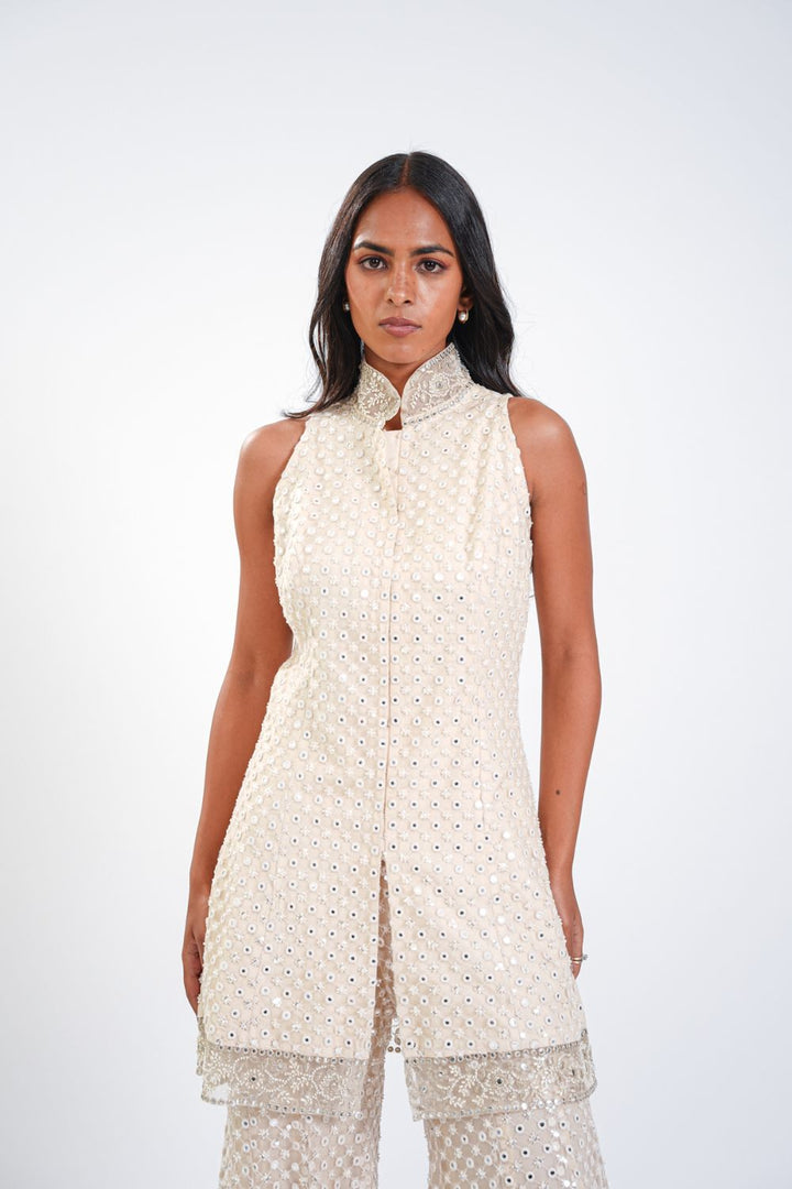 SLEEVELESS PEPLUM TOP