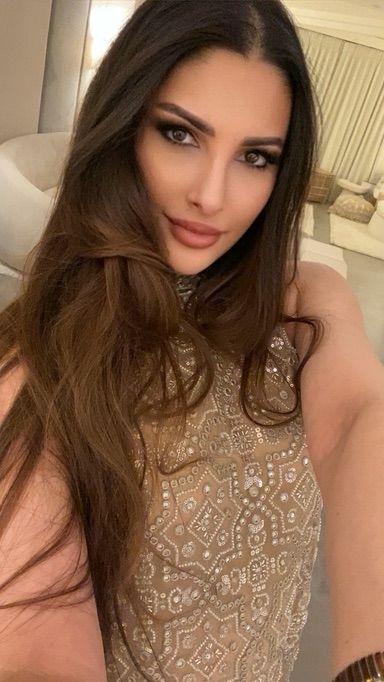 Zainab in our Peplum Top With Slit At Back and Tissue Bootcut Pants