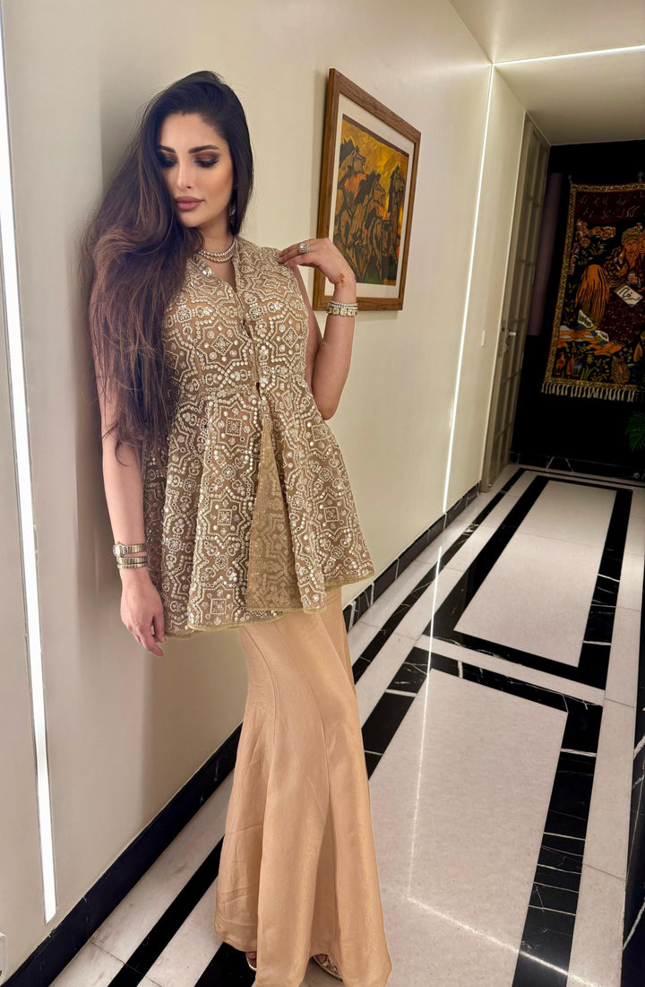 Zainab in our Peplum Top With Slit At Back and Tissue Bootcut Pants